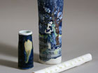 Porcelain and Stoneware Still Life. Papageno Papagena duet, Sun and Moon Vessel, scrolled duet music score.